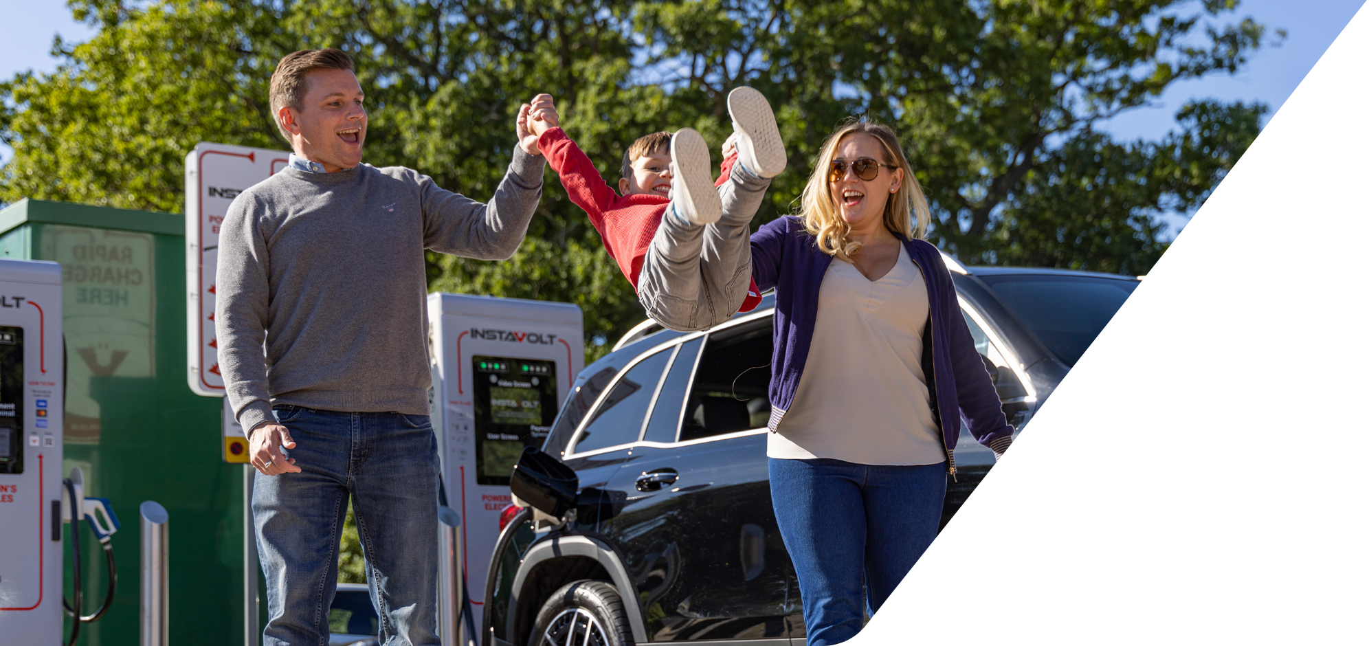 Family using an InstaVolt electric vehicle rapid charging station / point