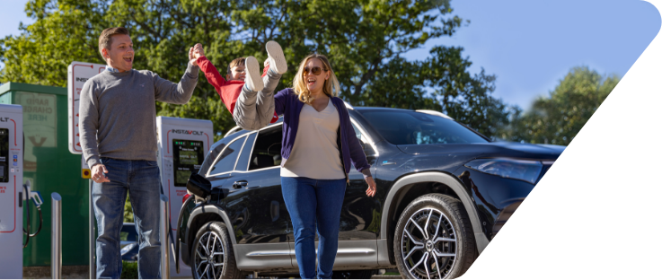 Family using an InstaVolt electric vehicle rapid charging station / point